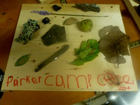 nature boards that have rocks, leaves and other items attached with glue-Camp CeCe