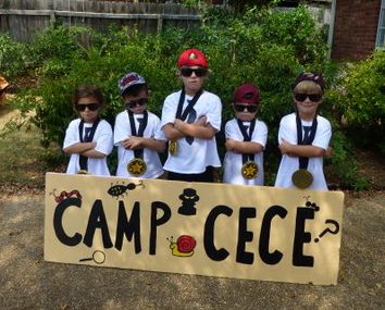 Secret Agent camp trainees with Camp CeCe sign
